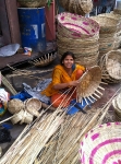 Woman making bamboo baskets