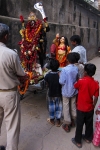 Readying deities for procession and display